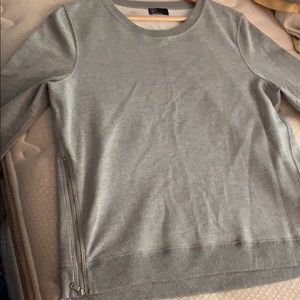 Gray long sleeve sweater.
